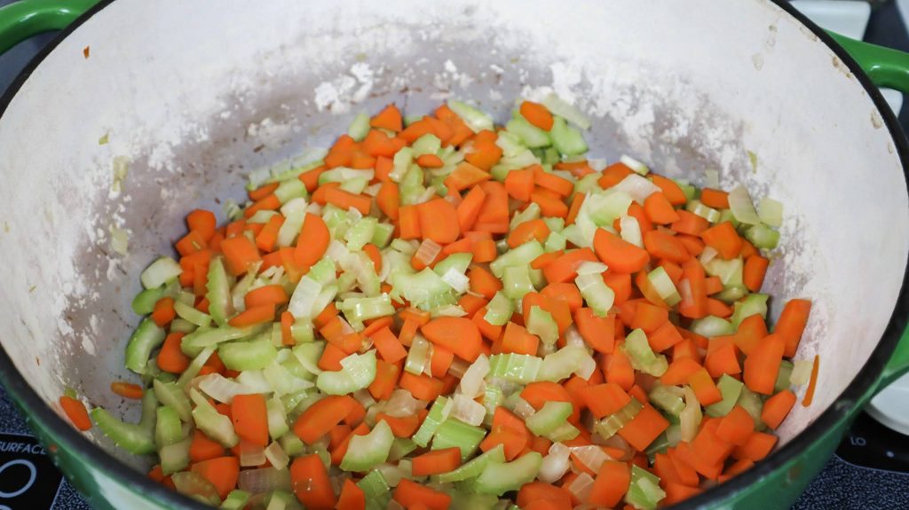 chopped vegetables in a dutch oven 