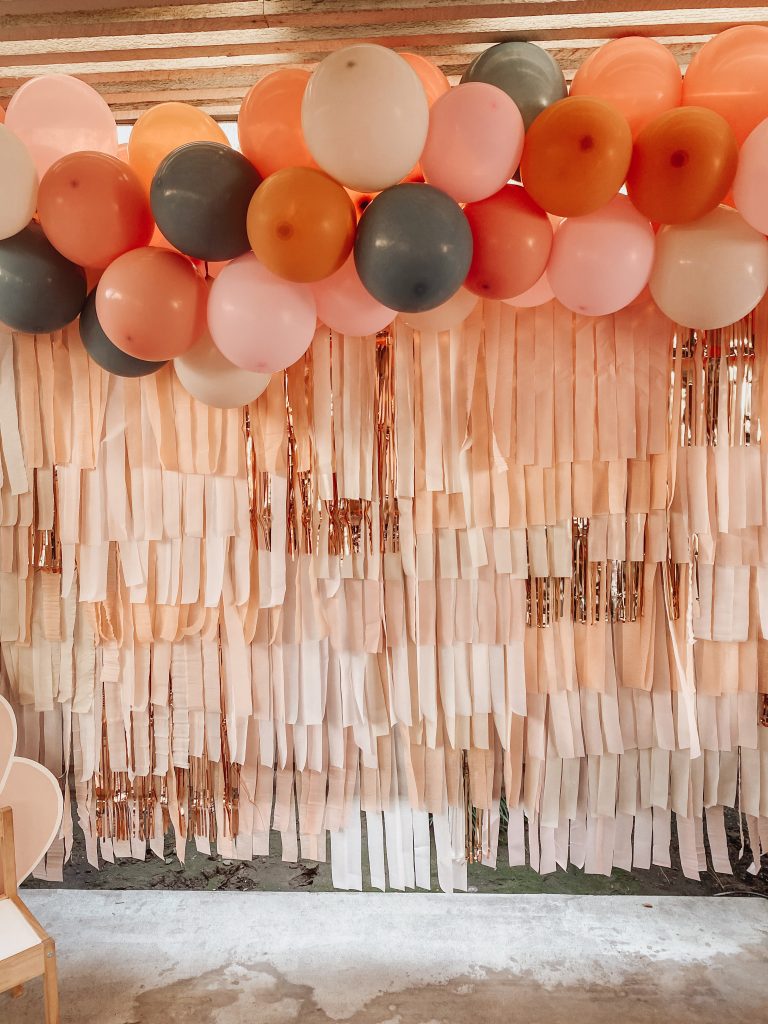balloons and a photo backdrop for a birthday party