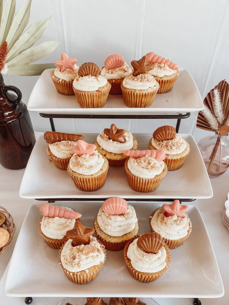 cupcakes topped with chocolate seashells