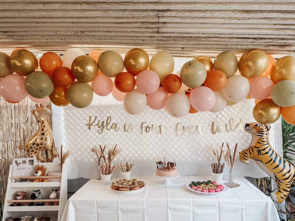 decorations for a four ever wild themed birthday celebration
