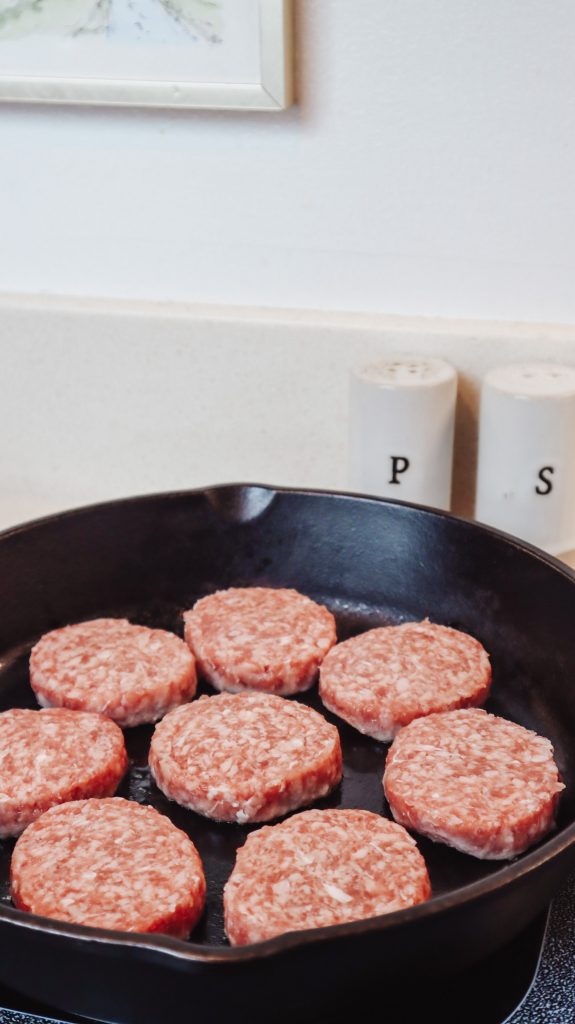 cast iron skillet with breakfast sausage patties